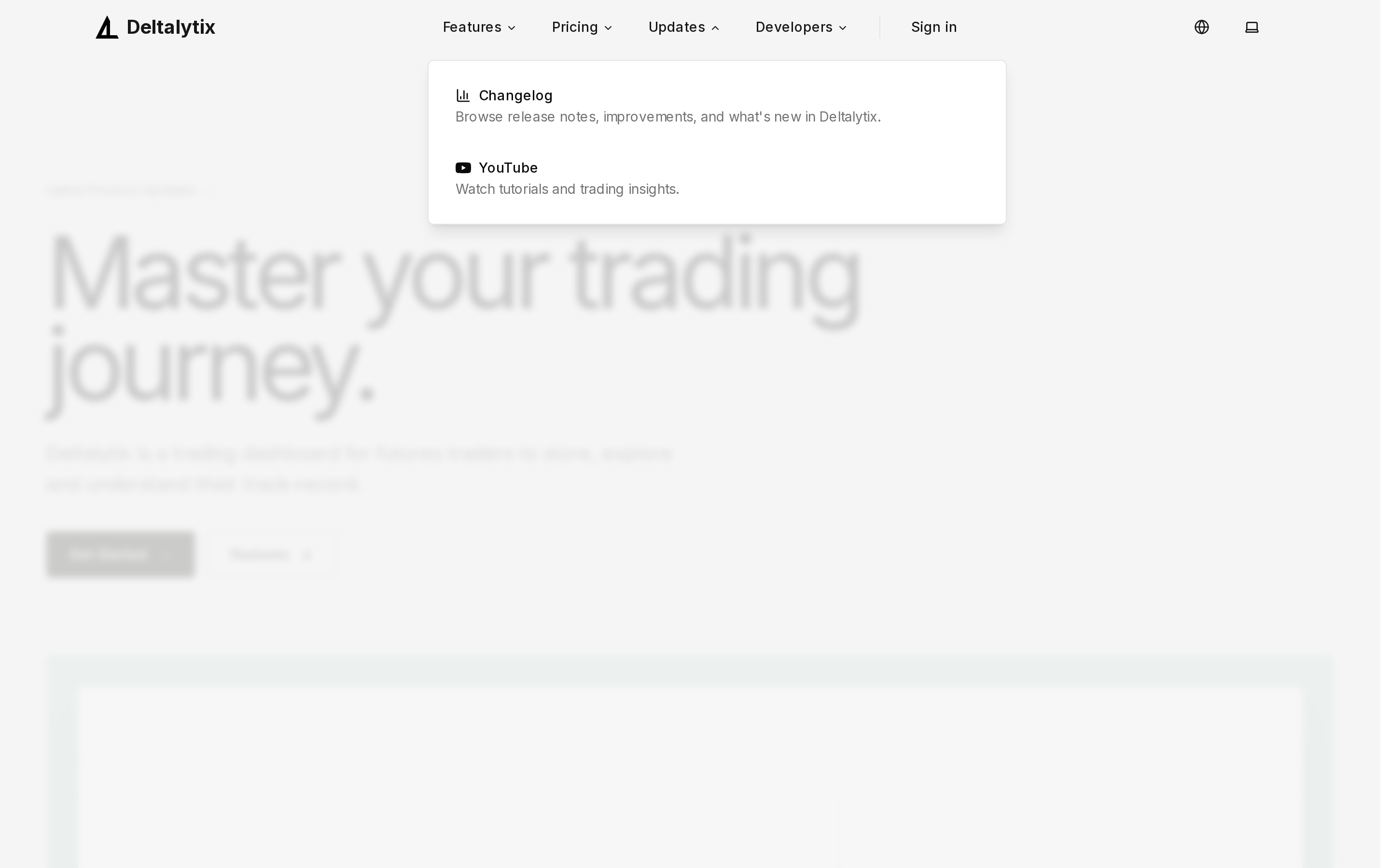 Landing page navbar with Features and Updates dropdown menus